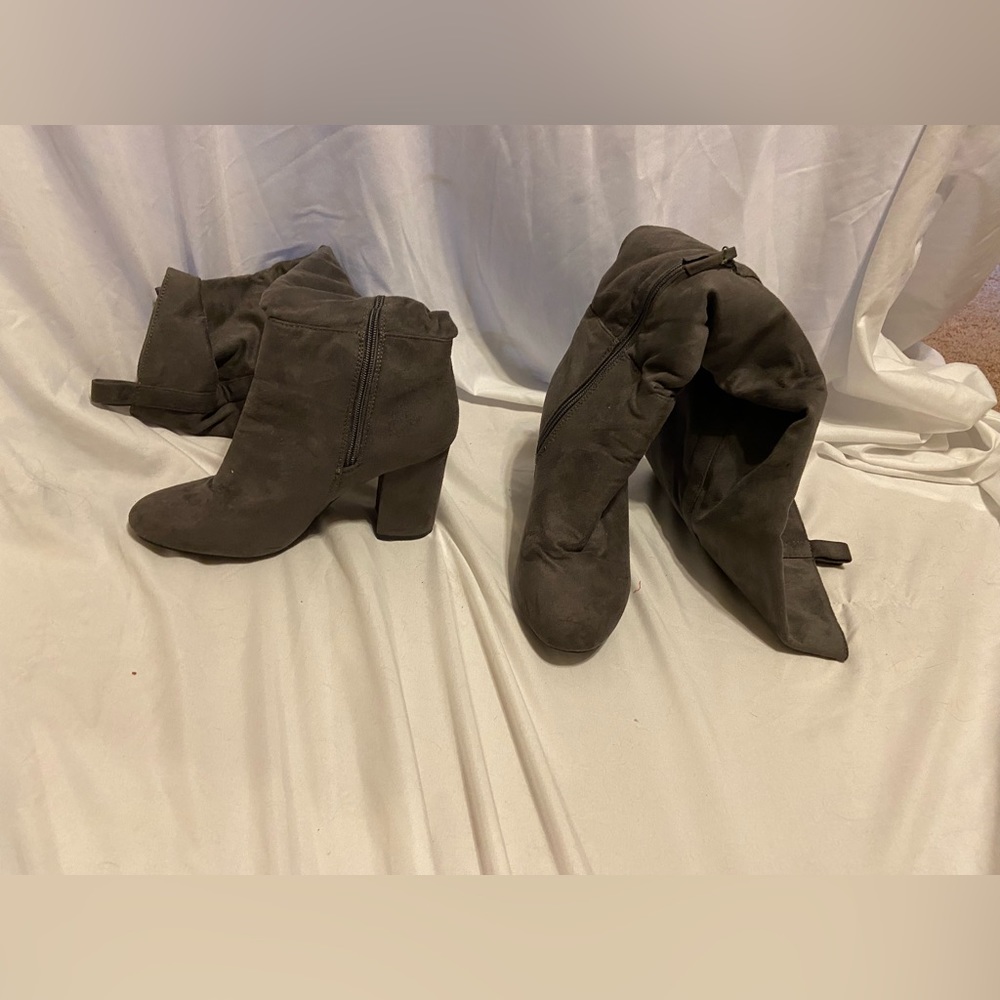 Knee high zip up heeled boots